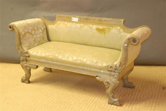 Appraisal: AMERICAN EMPIRESETTEE Carved back dolphin scroll arms and feet Paint