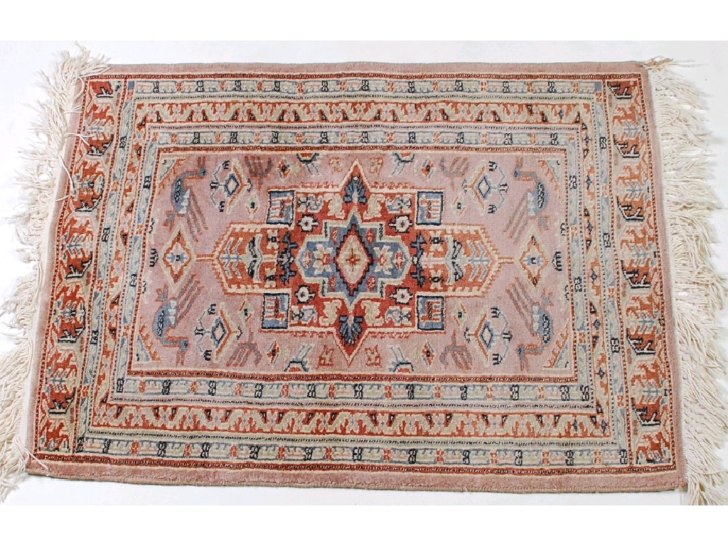 Appraisal: PAKISTAN PURE WOOL RUG mushroom coloured with large centre angular