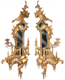 Appraisal: A PAIR CARVED GILDED ROCOCO STYLE MIRRORED SCONCES A good