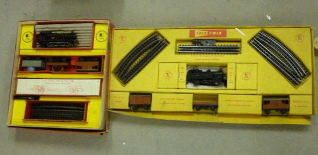 Appraisal: Two playworn Trix Twin train sets F - - Goods