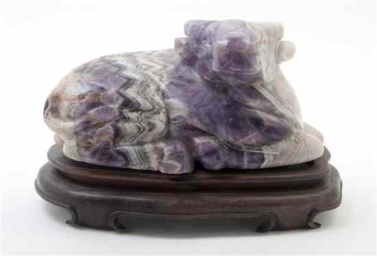 Appraisal: A Carved Amethyst Quartz Ox depicted in a recumbent pose