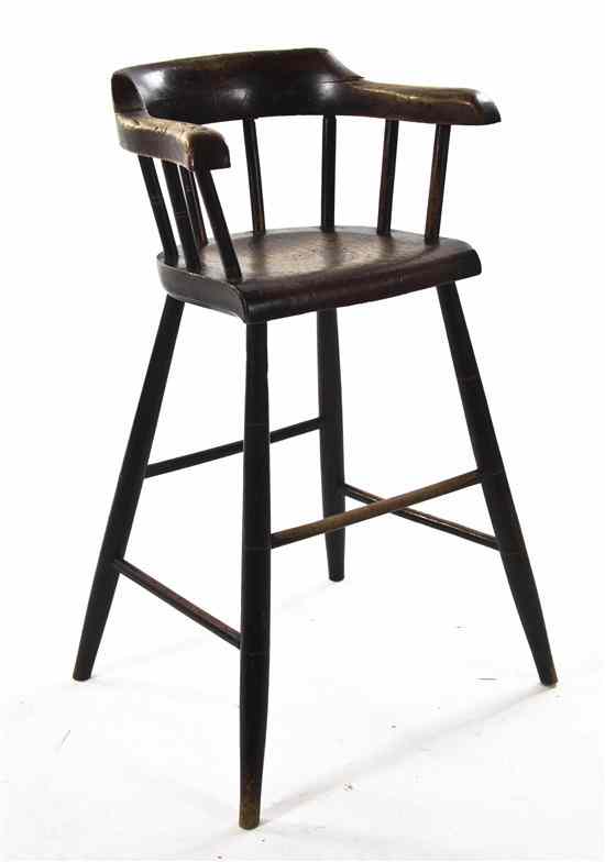 Appraisal: A Provincial Style Walnut High Chair having a spindle back