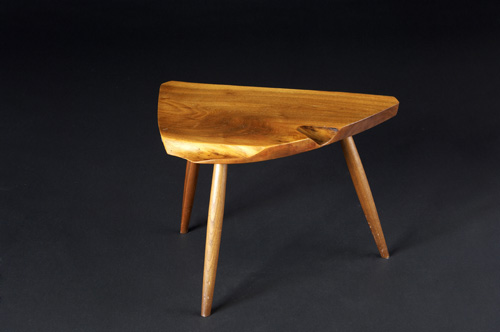 Appraisal: GEORGE NAKASHIMA Three-legged walnut side table with free-edge top From