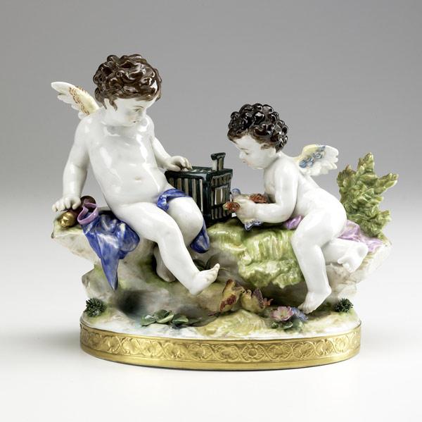 Appraisal: DRESDEN-TYPE PORCELAIN Cherub group attending to doves in a cage