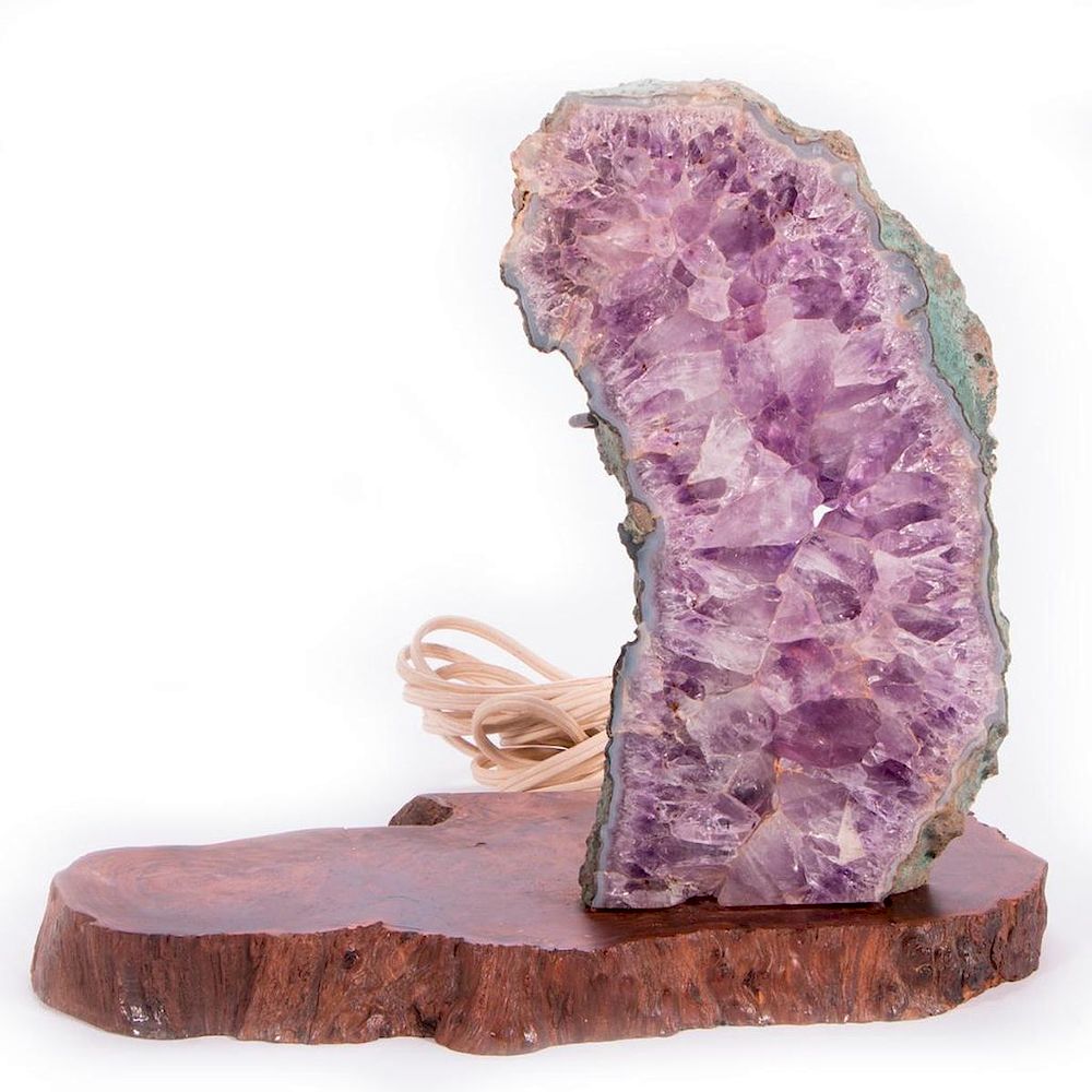 Appraisal: Large Amethyst geode mounted on stand A large Amethyst geode