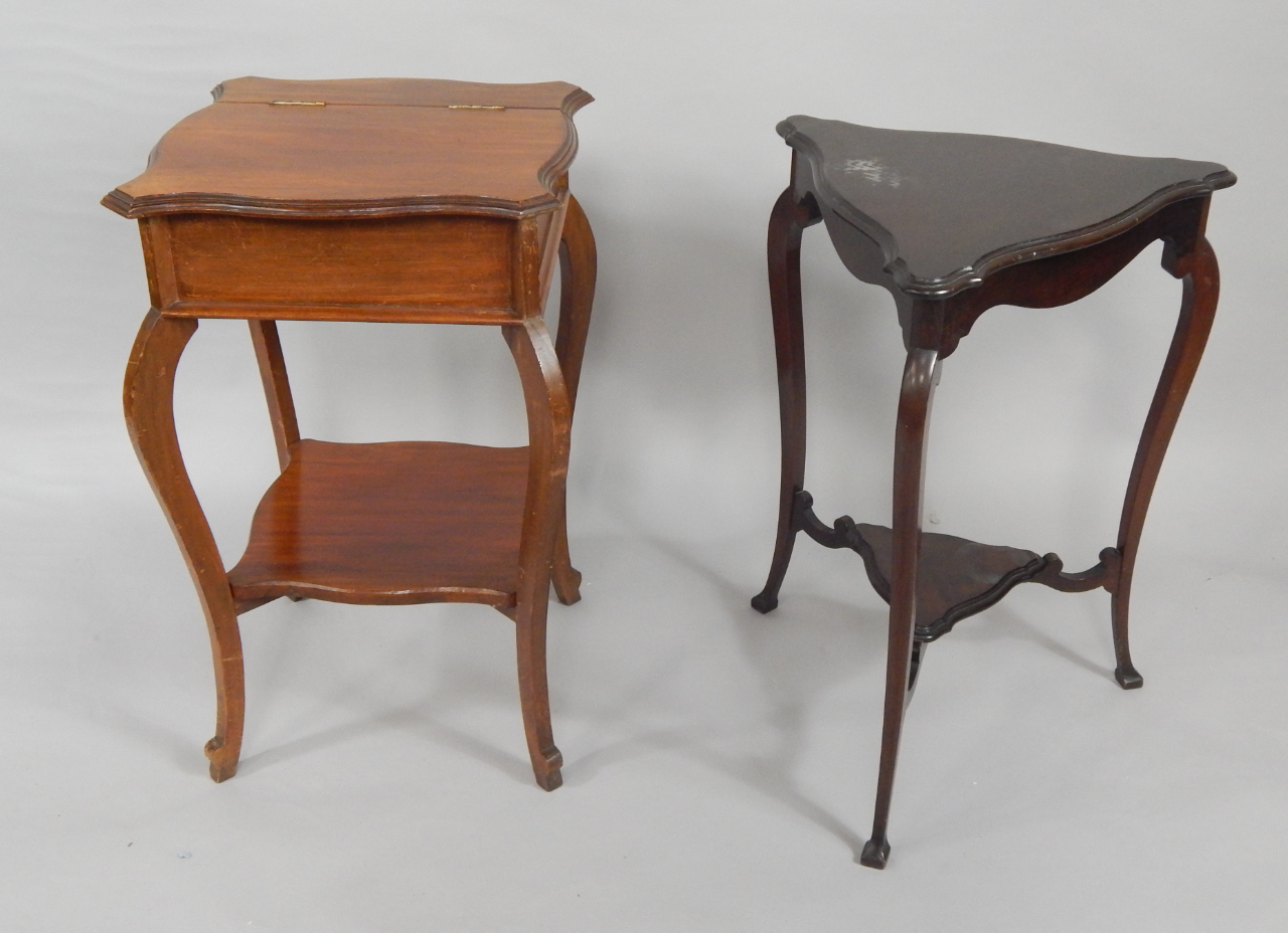 Appraisal: A Victorian mahogany sewing table the serpentine lidded top enclosing