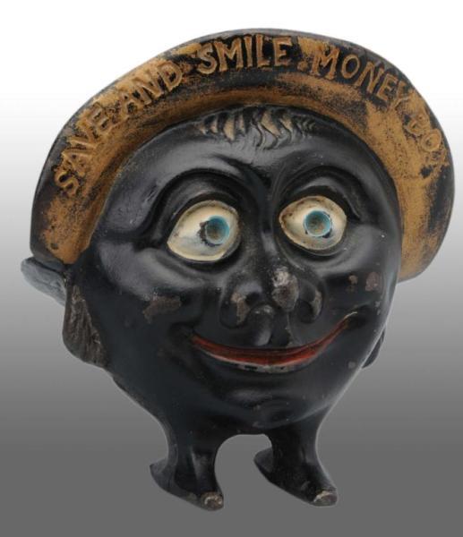 Appraisal: Cast Iron Save Smile Still Bank Description Made in England