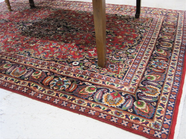 Appraisal: PERSIAN KASHAN CARPET floral and central floral medallion type with