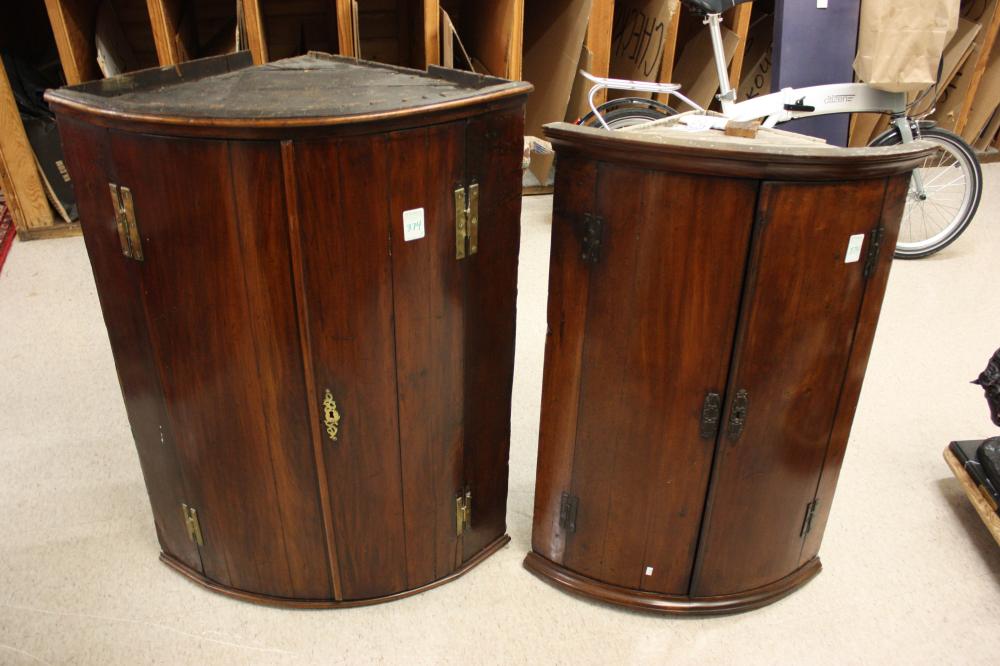 Appraisal: TWO GEORGIAN MAHOGANY WALL-MOUNT CORNER CUPBOARDS English late th early