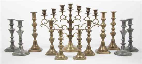 Appraisal: A Collection of Seven Brass Candlesticks of various sizes together