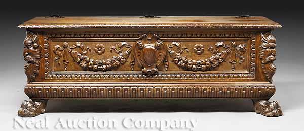 Appraisal: An Italian Baroque-Style Carved Walnut Cassone th c hinged top