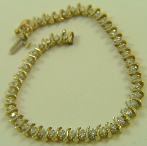 Appraisal: DIAMOND AND TEN KARAT GOLD BRACELET - in length and