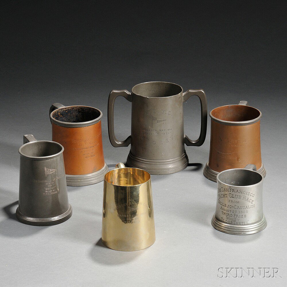 Appraisal: Six Metal Tankard-form Yachting Trophies all with colorless glass feet