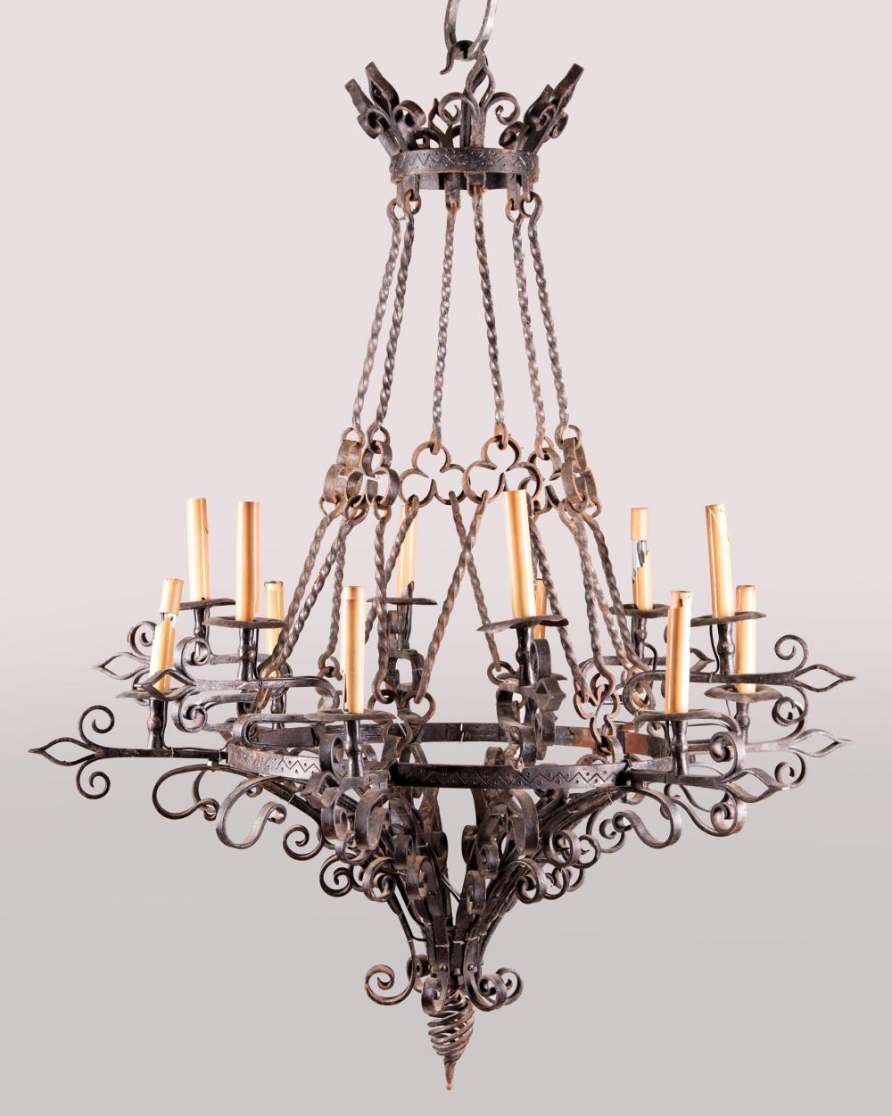 Appraisal: Renaissance Revival Iron Twelve-Light Chandelier crown shaped corona scroll arms