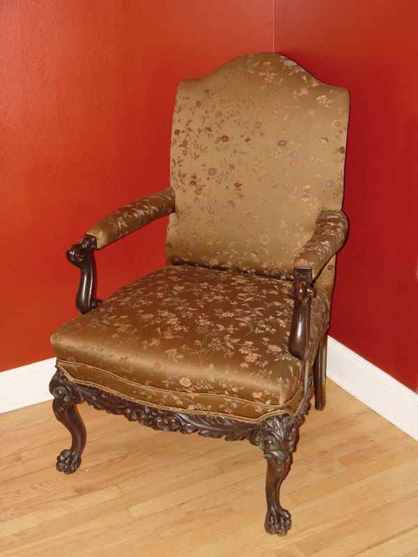 Appraisal: VICTORIAN CARVED AND UPHOLSTERED ARM CHAIR High back upholstered seat