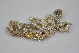 Appraisal: Silver Albert chain with fourteen various charms attached to w