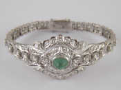 Appraisal: A rhodium plated metal tests carat gold cabochon emerald and