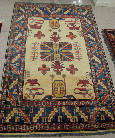 Appraisal: TWO PAKISTANI CAUCASIAN AREA RUGS the cream fields of both