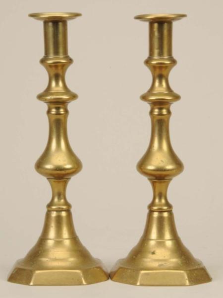 Appraisal: Pair of English Brass Candlesticks Description Core-cast with ejectors Good