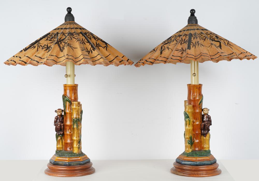 Appraisal: PAIR OF CERAMIC MONKEY TABLE LAMPSeach with a parasol-form shade