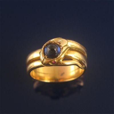 Appraisal: A gold snake ring the head mounted with a cabochon