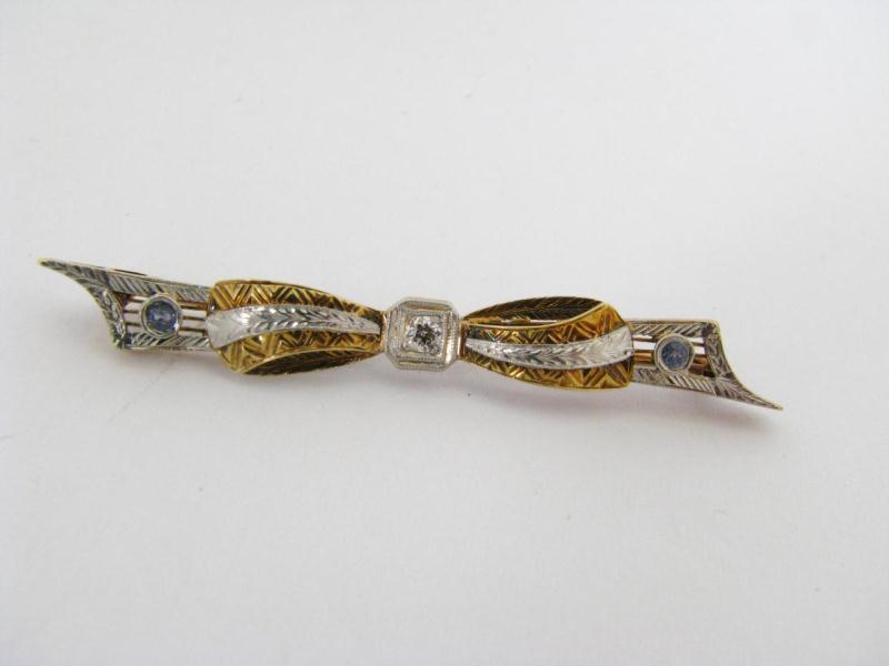 Appraisal: A K Two Tone Gold Bar Pin with Diamonds and