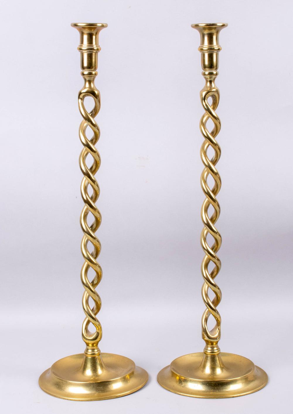 Appraisal: PAIR OF TALL BARLEY TWIST ENGLISH BRASS CANDLESTICKS of traditional