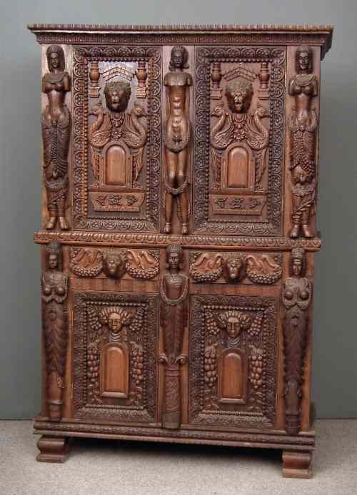 Appraisal: An Anglo Indian hardwood two tier cabinet boldly carved with