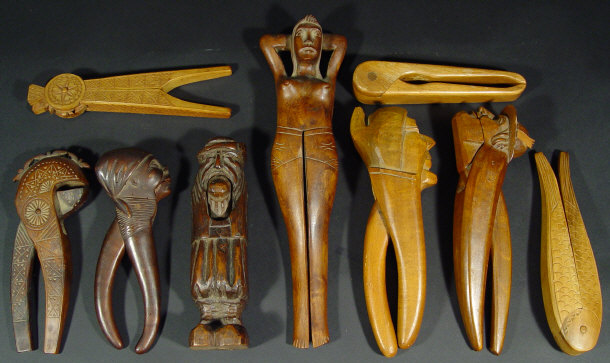 Appraisal: Nine sets of wooden nutcrackers including a reclining nude woman