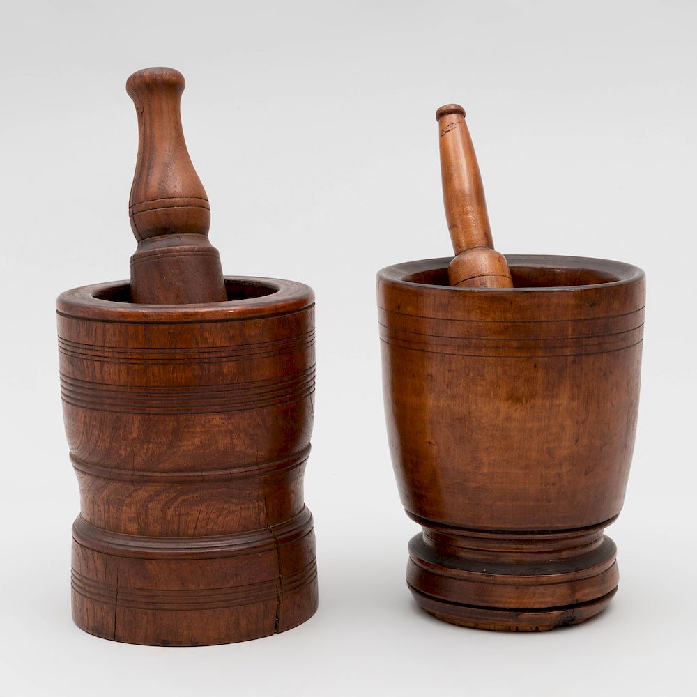 Appraisal: Two Carved Wood Mortars and Two Pestles The larger mortar