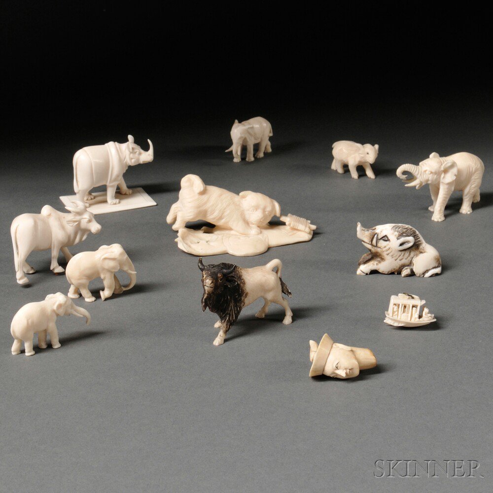 Appraisal: Twelve Miniature Ivory and Bone Carvings Japan an ox two