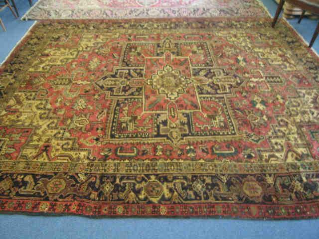 Appraisal: Heriz Persian Handmade Room Size Rug geometrics throughout earthtones '