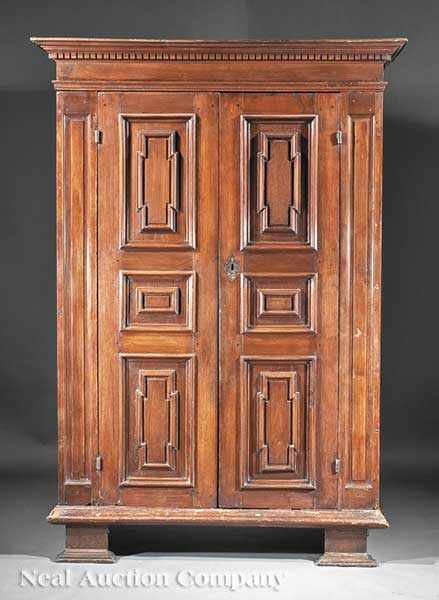 Appraisal: A Flemish Walnut Armoire mid- th c dentil-molded cornice above