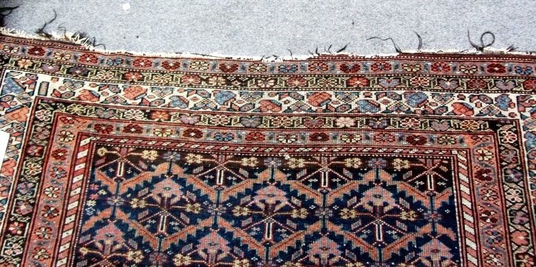 Appraisal: A Fereghan carpet Persian the indigo field with rows of