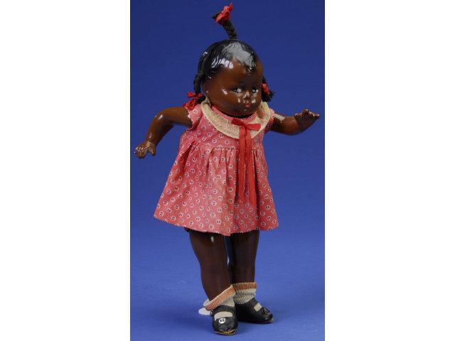 Appraisal: Rare Black Grumpy Girl America ca composition shoulder head embossed