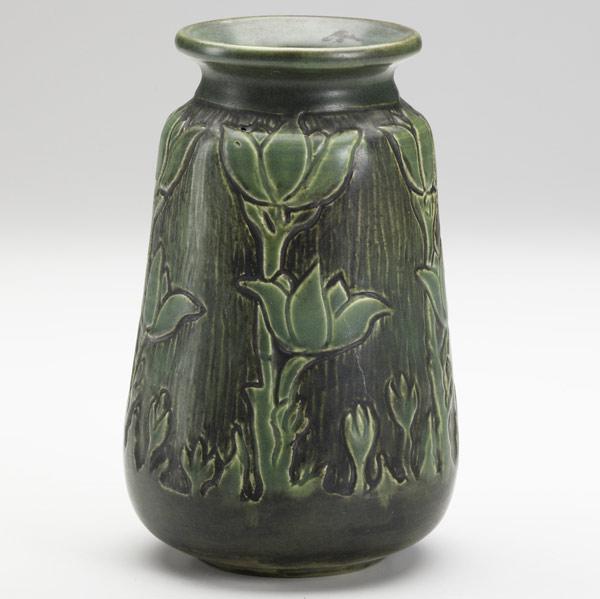 Appraisal: FLORA HUCKFIELDNORTH DAKOTA SCHOOL OF MINESCarved vase with plants illeg