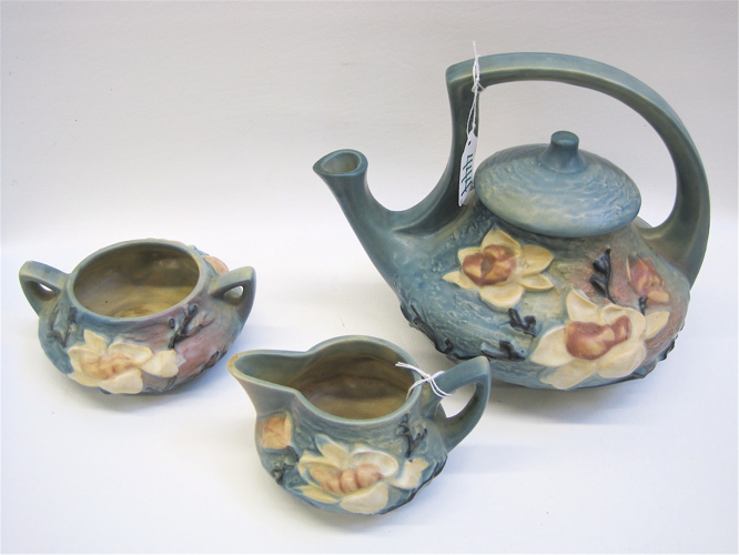 Appraisal: THREE PIECE ROSEVILLE ART POTTERY TEA SET in the Magnolia