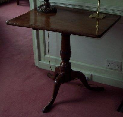 Appraisal: A George III mahogany occasional table the rectangular top on