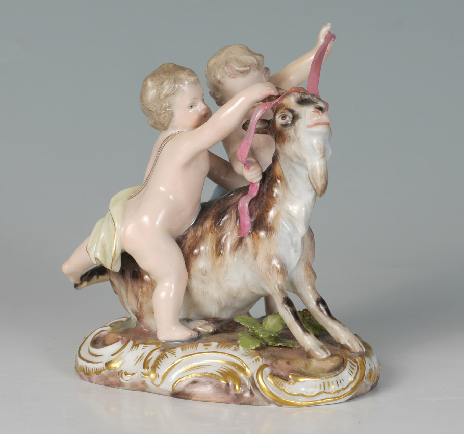 Appraisal: MEISSEN FIGURAL GROUP PUTTI WITH GOAT Grouping of putti and