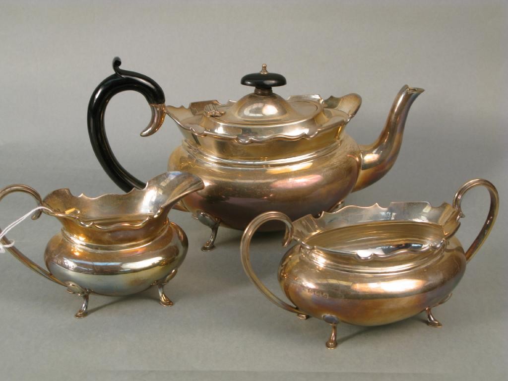 Appraisal: A silver tea set teapot milk jug and two handled