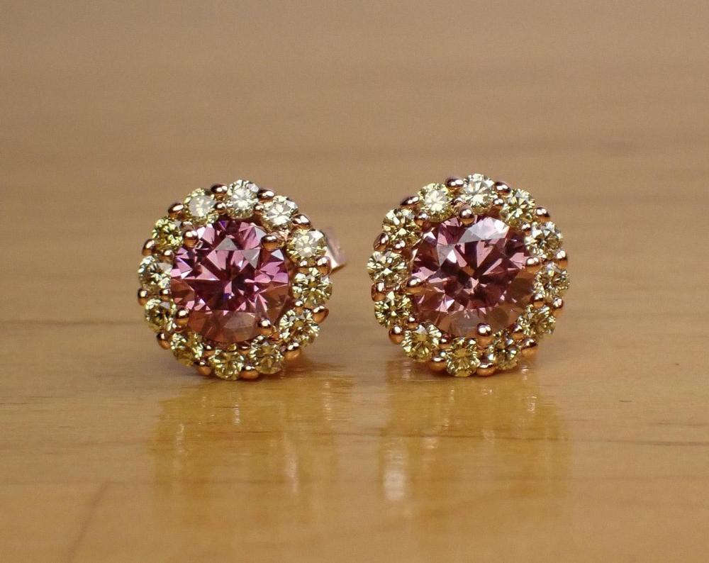 Appraisal: A PAIR OF PINK DIAMOND WHITE DIAMONDS AND FOURTEEN KARAT