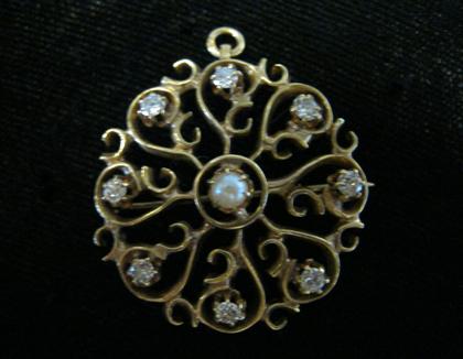 Appraisal: karat yellow gold diamond and pearl starburst broochSet with eight