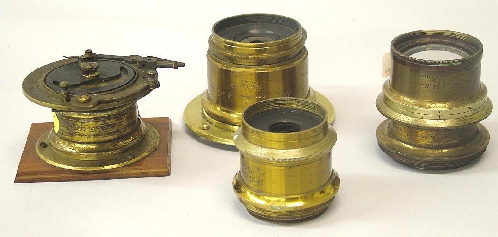 Appraisal: Four various brass bound Lancaster lenses one with wheel stops