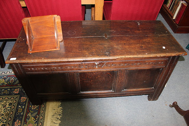 Appraisal: AN ANTIQUE OAK COFFER with triple panelled front standing on