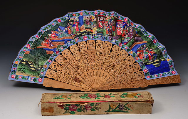 Appraisal: A CHINESE FAN with sandalwood sticks with carved guards and