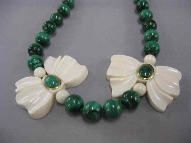 Appraisal: Malacite Bead Necklacewith gold carved ivory ''bows'' '' long