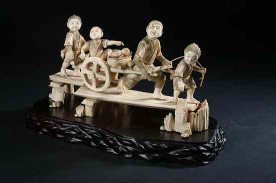 Appraisal: JAPANESE IVORY OKIMONO OF FOUR MEN AND A CHARIOT Meiji