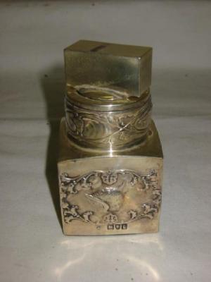 Appraisal: AN EDWARDIAN SCENT BOTTLE of oblong form cased in silver