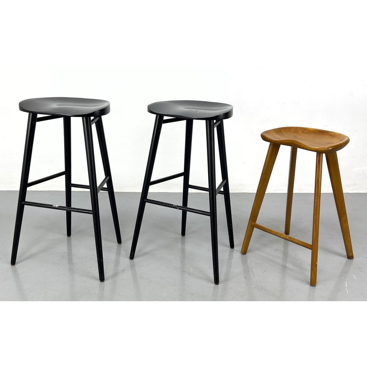 Appraisal: Three Sculptural Wood Counter Bar Stools Black one sculpted oak