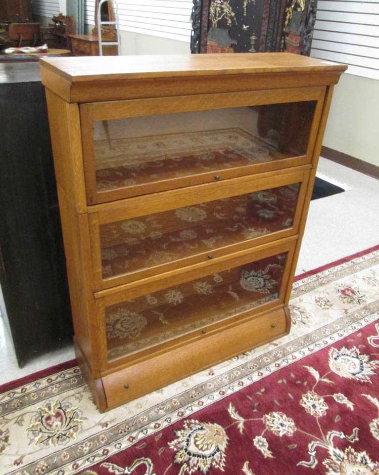 Appraisal: STACKING OAK BOOKCASE American early th century having three horizontal